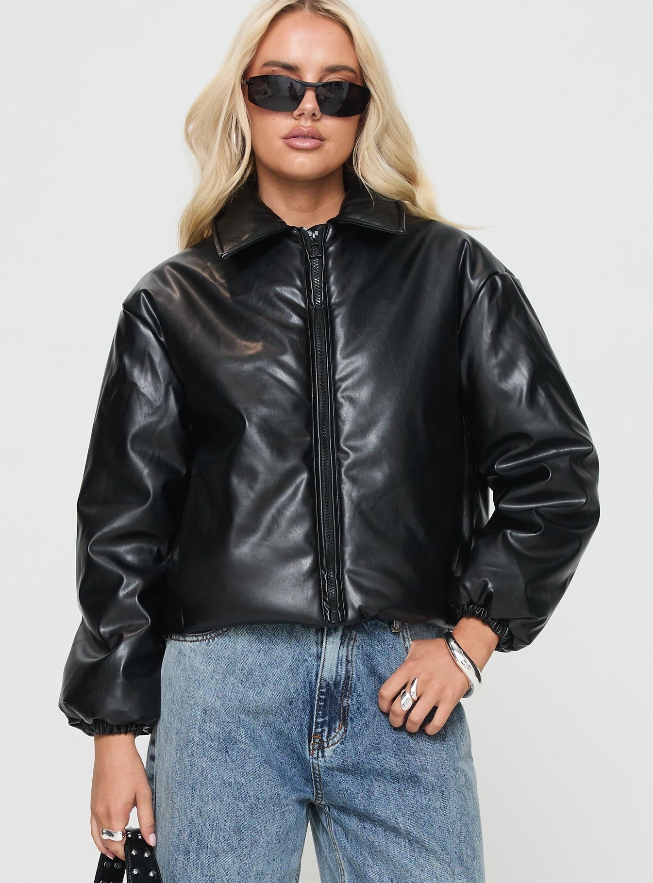 Black jacket Classic collar, exposed zip fastening, drawstring at waist, twin pockets
