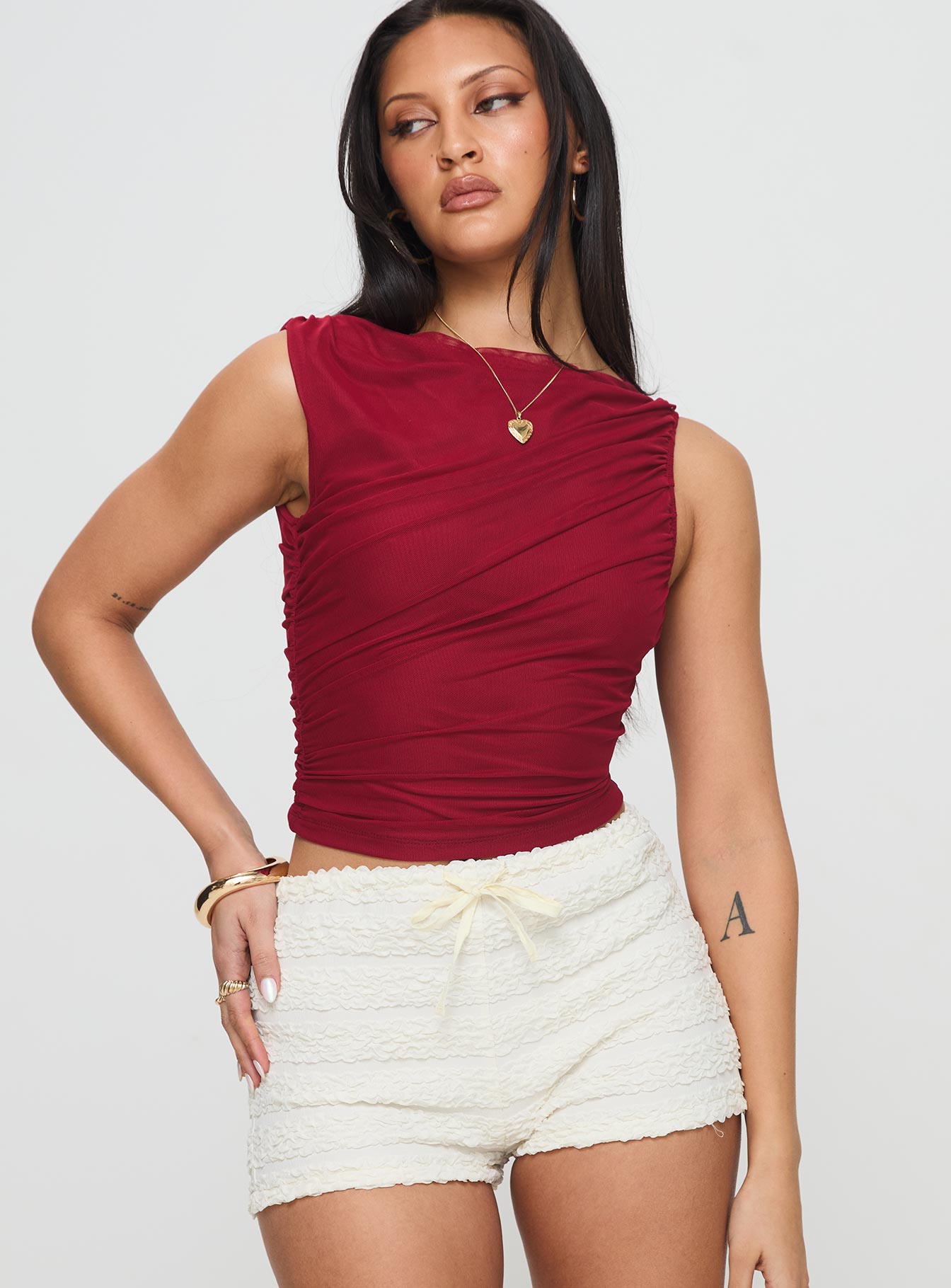 front view of model wearing Princess Polly Hasso Top Burgundy Sleeveless Crew Neck 