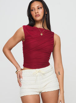 front view of model wearing Princess Polly Hasso Top Burgundy Sleeveless Crew Neck 