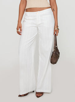 front view of model wearing Princess Polly Vendi Low Rise Pant White Petite Low Rise Pants 