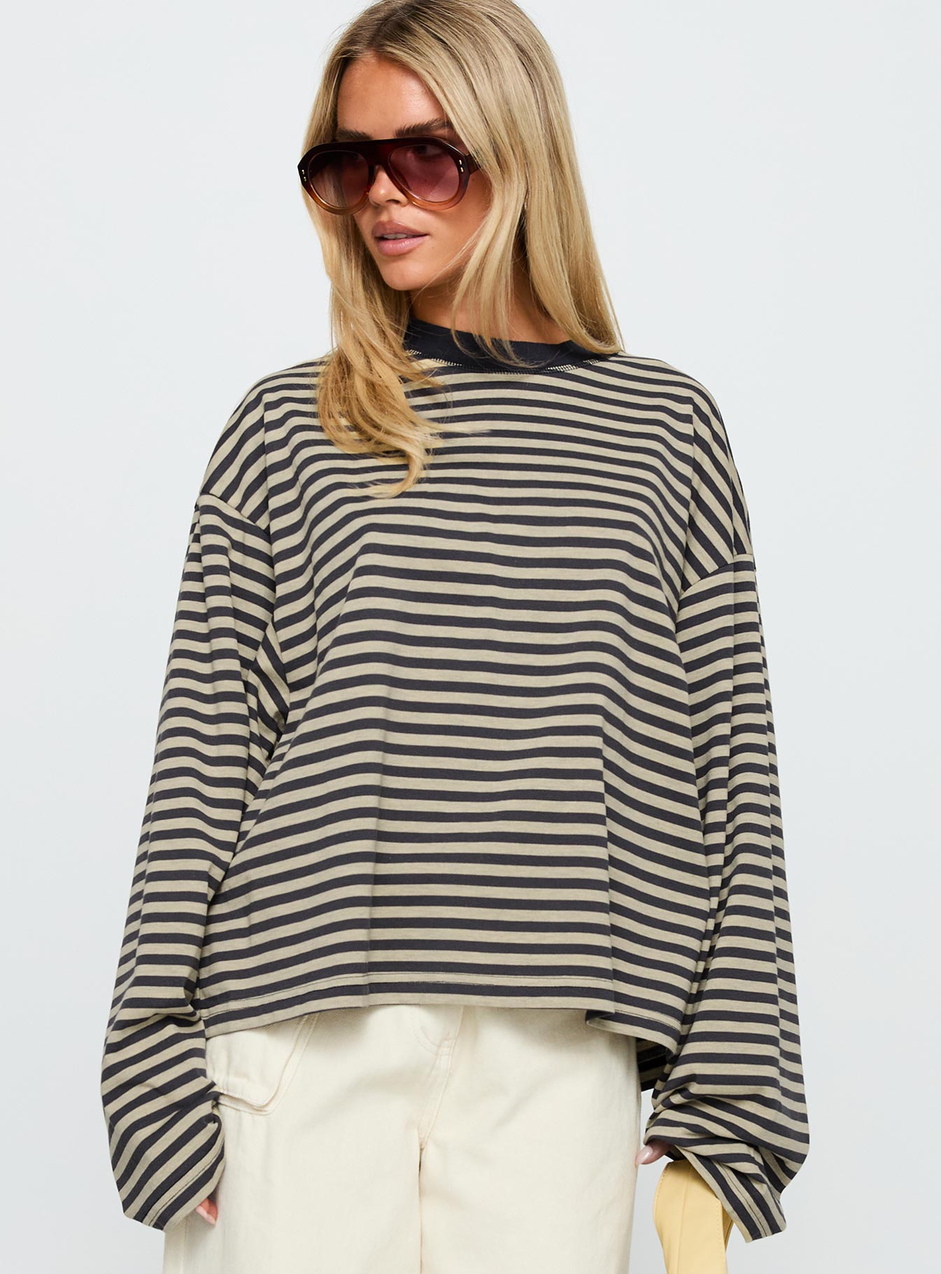 front view of model wearing Princess Polly Bloom Long Sleeve Top Beige Stripe Full Sleeves Crew Neck 