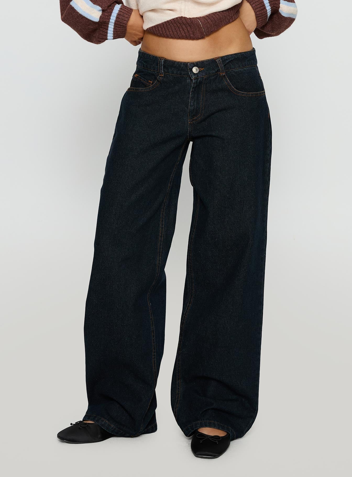 back view of model wearing Princess Polly Korinne Low Rise Bootleg Jeans Indigo Low Rise Jeans 