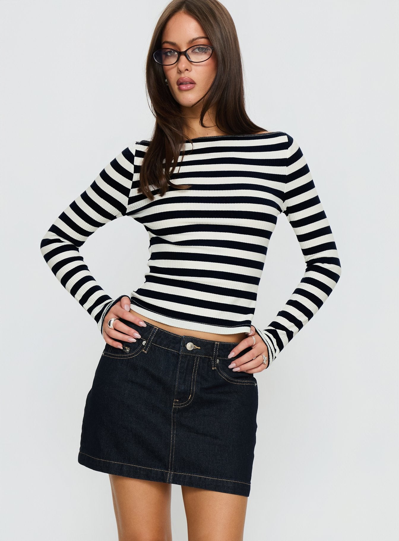   front view of model wearing Princess Polly Nickei Denim Mini Skirt Raw Dark Wash Mini Skirts 