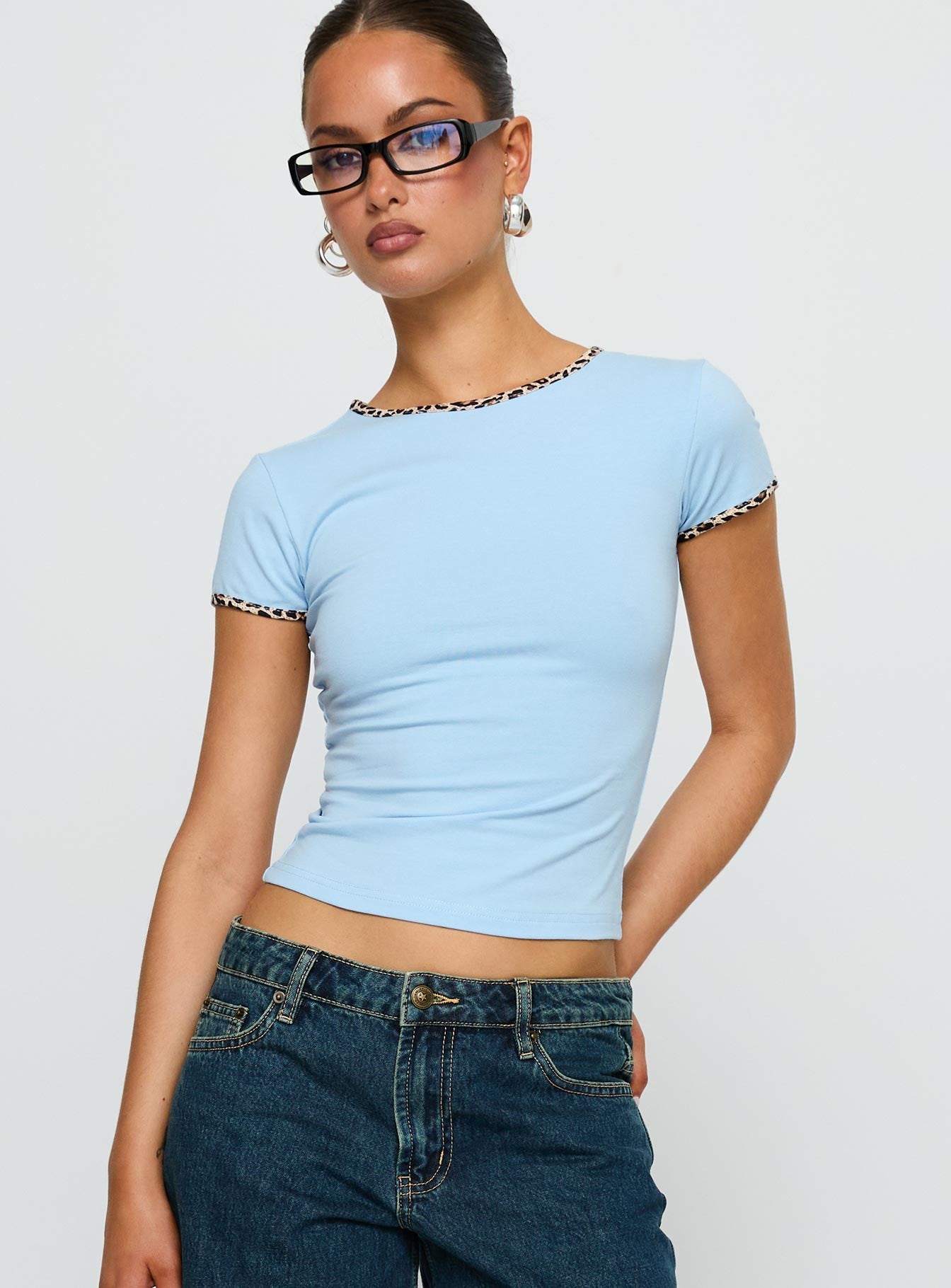 front view of model wearing Princess Polly Torissa Top Blue Short Sleeves Crew Neck 