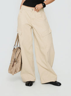 side view of model wearing Princess Polly Selective Memory Low Rise Wide Leg Cargo Pants Cream Low Rise Pants 