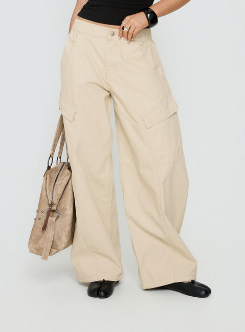side view of model wearing Princess Polly Selective Memory Low Rise Wide Leg Cargo Pants Cream Low Rise Pants 