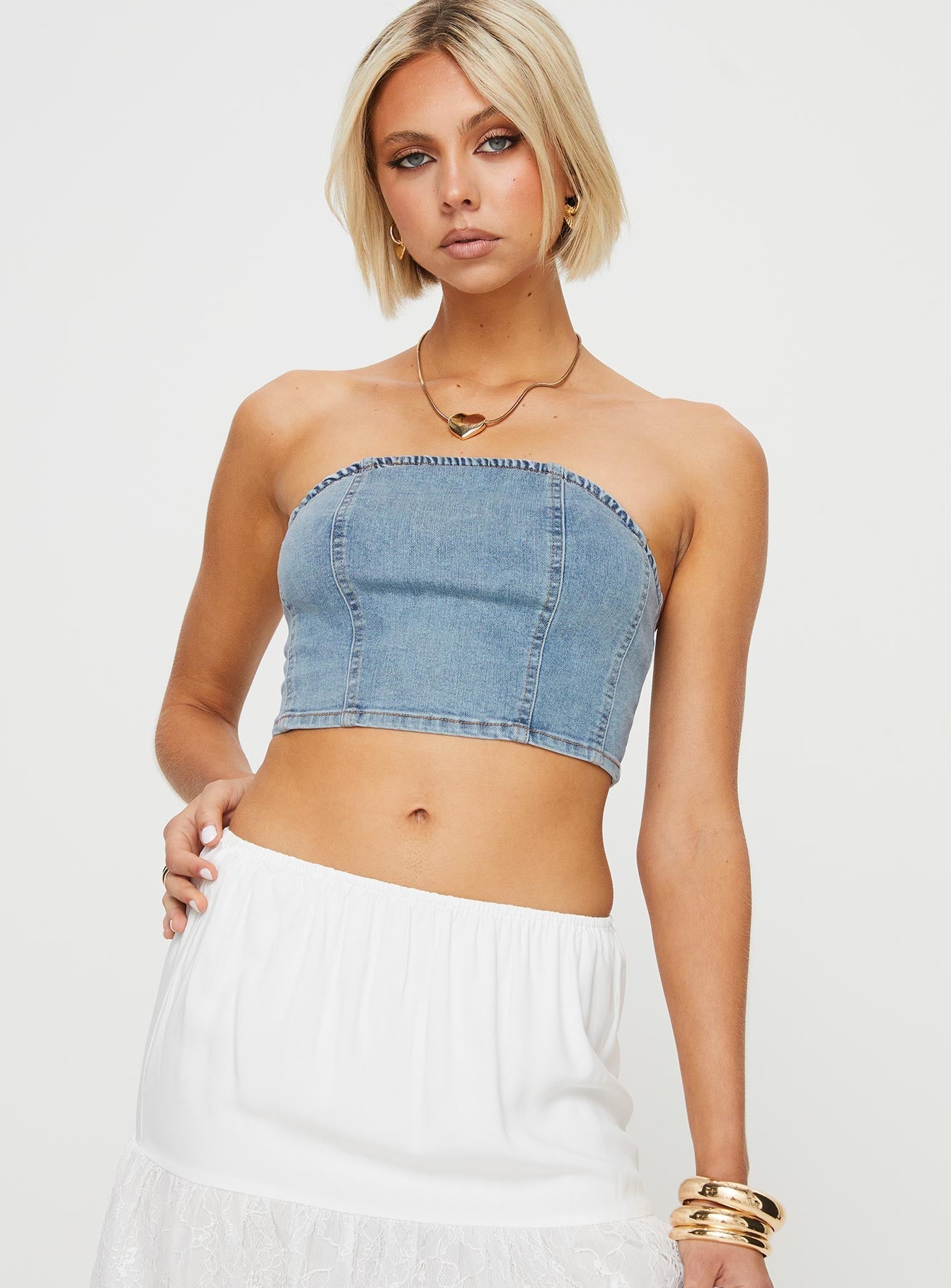 Strapless denim top Inner silicone strip at bust, shirred band at back Good stretch, unlined 