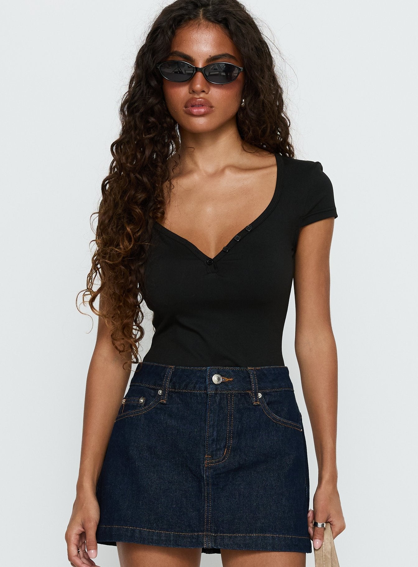 front view of model wearing Princess Polly Laretta Button Up Bodysuit Black Short Sleeve 