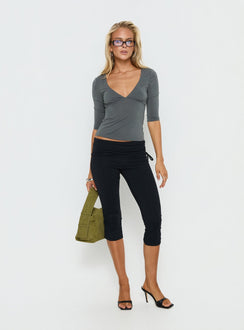 back view of model wearing Princess Polly Bailor Channel Waistband Capri Pants Black Mid Rise Pants 