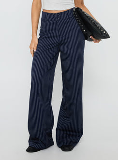 side view of model wearing Princess Polly Lorenne Mid Rise Pant Navy Pinstripe High Waisted Pants 