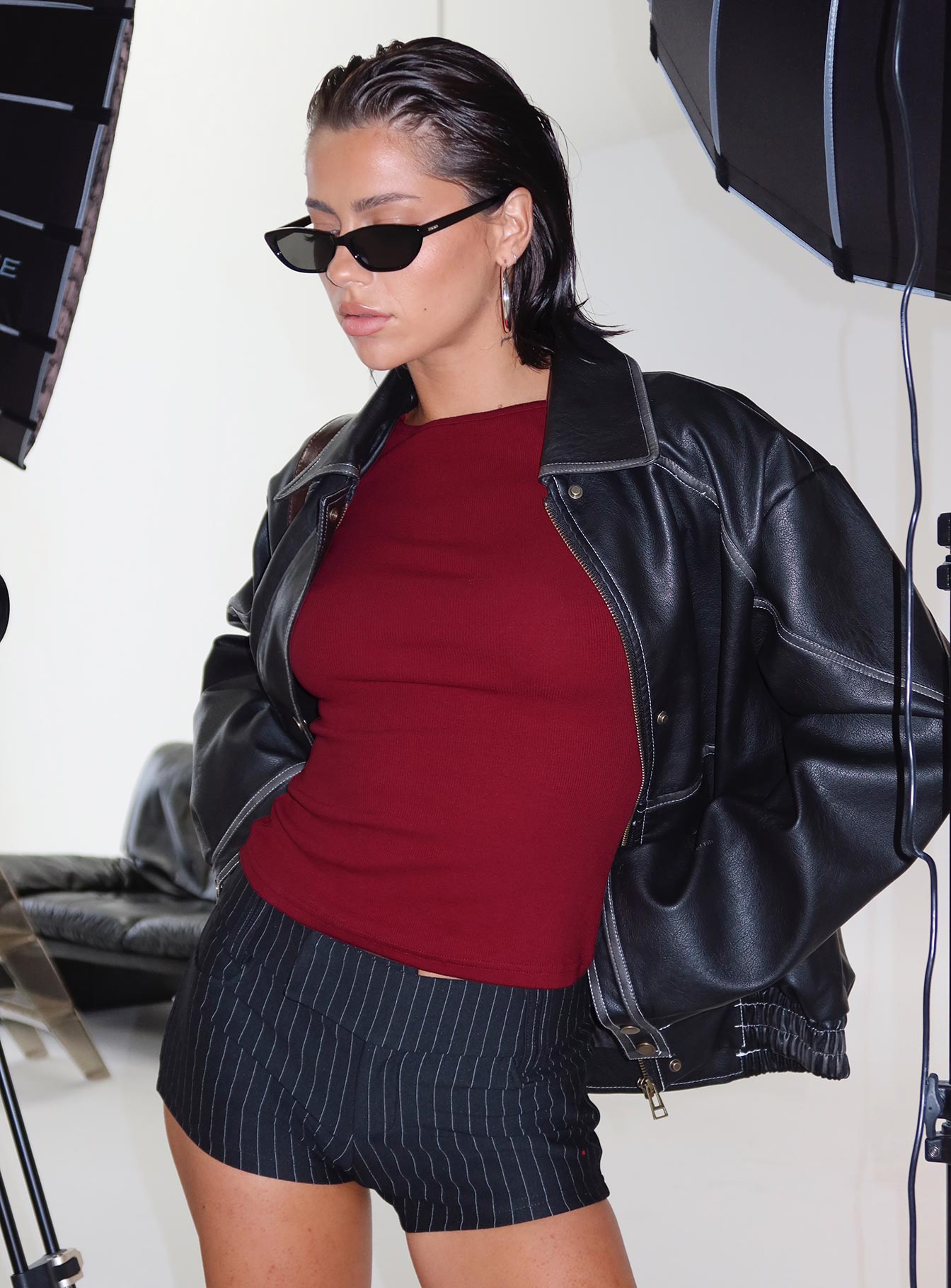 back view of model wearing Princess Polly Minette Micro Shorts Black Pinstripe Low Rise Shorts 