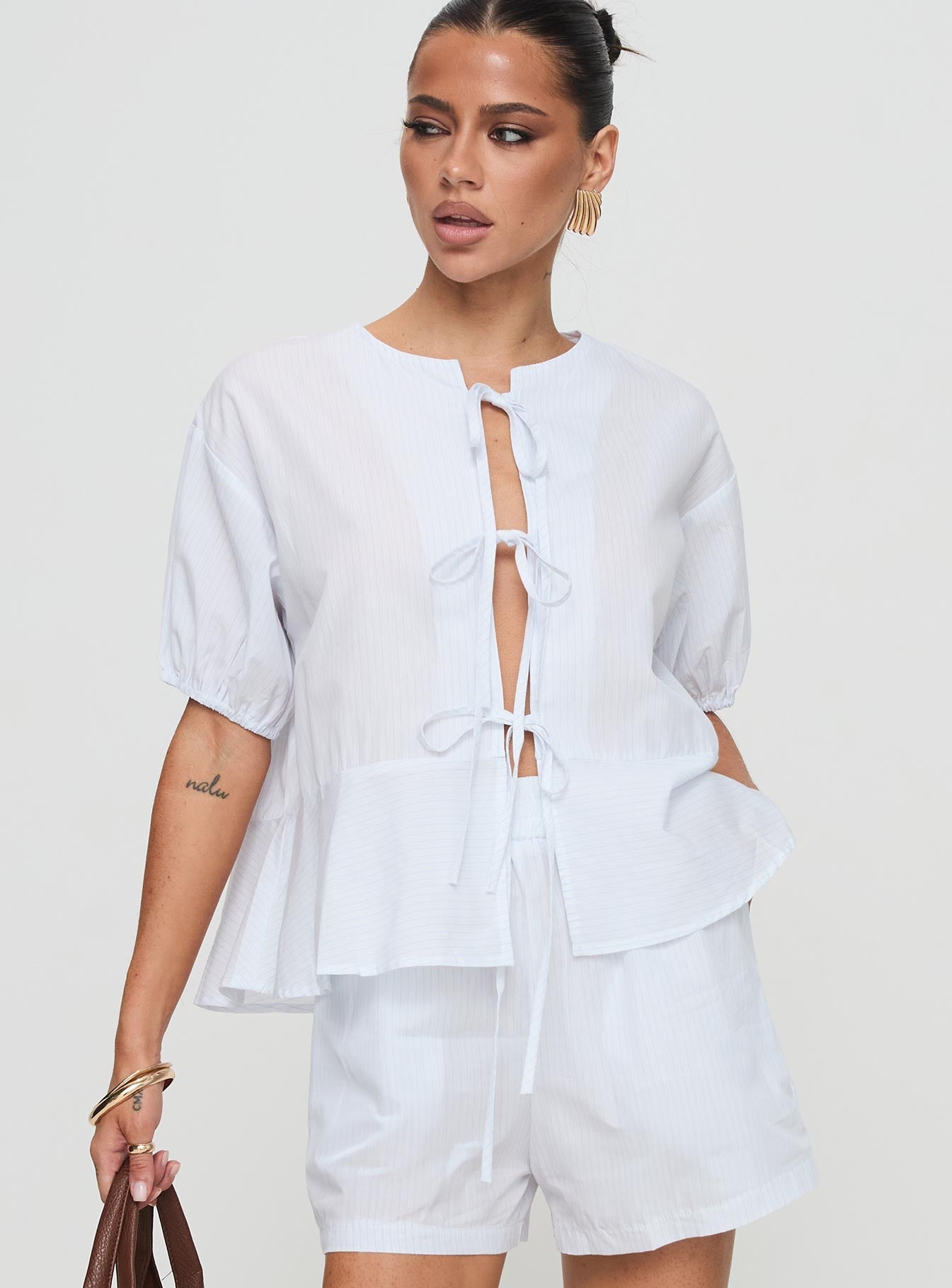 front view of model wearing Princess Polly Sunblind Top White Half Sleeves Crew Neck 