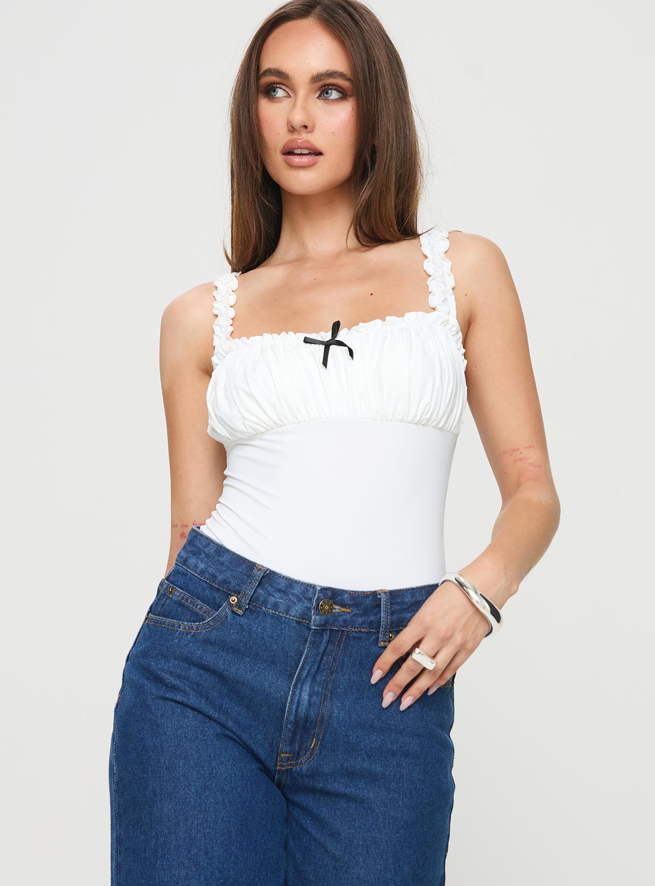 Bodysuit Elasticated shoulder straps, square neckline, ruched bust, high cut leg, press clip fastening, cheeky style bottom Good stretch, lined bust Princess Polly Lower Impact