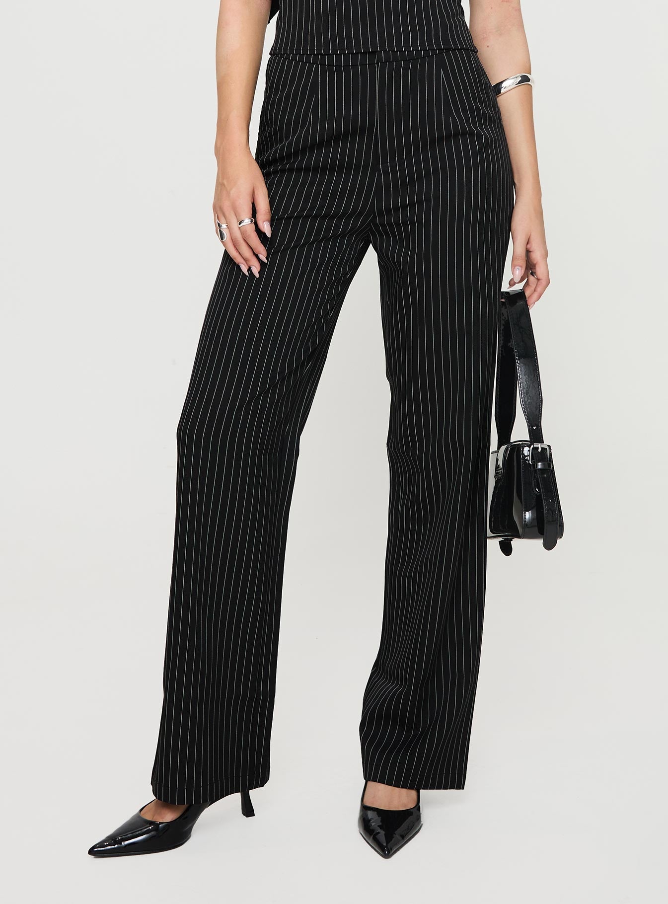 Pinstriped pants High rise fit, button & clasp fastening, twin hip pockets Non-stretch material, unlined 