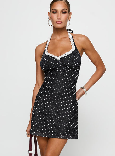 front view of model wearing Princess Polly Black Beauty Halter Mini Dress Black / Polka Plunger 