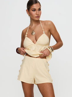 back view of model wearing Princess Polly Solid Gold Shorts Lemon High Waisted Shorts 