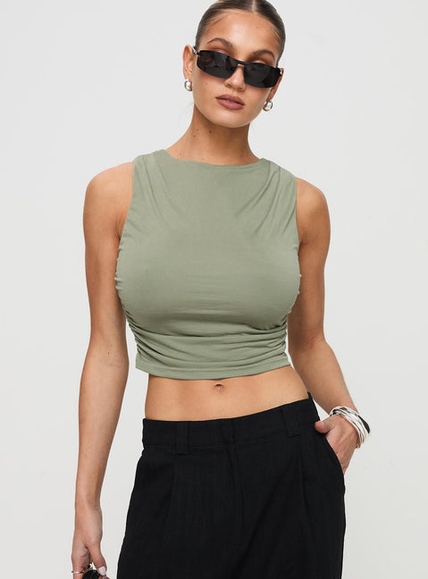 front view of model wearing Princess Polly Hold Em High Neck Top Green Sleeveless Crew Neck 