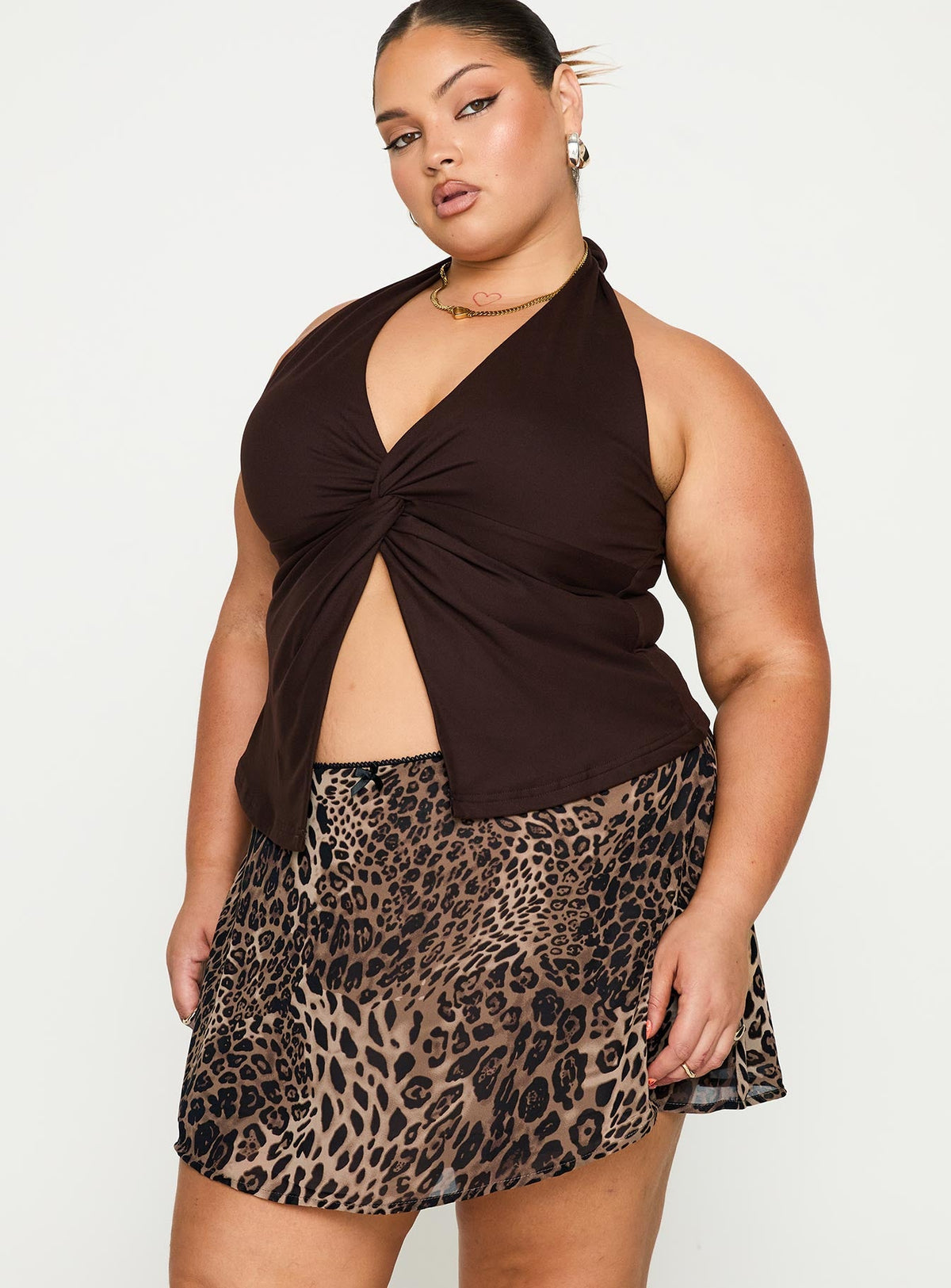   side view of model wearing Princess Polly Tejano Mini Skirt Leopard Curve Mini Skirts Skirts 