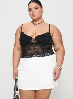 front view of model wearing Princess Polly Gigi Skort White Curve High Waisted Shorts 