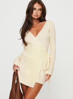 Long sleeve mini dress, knit material Wrap design with tie fastening at side, slightly flared cuff Good stretch, unlined 