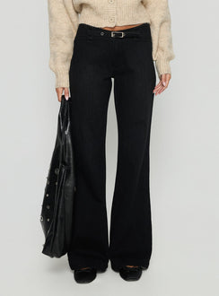 side view of model wearing Princess Polly Slow Ride Mid Rise Bootleg Belted Jeans Washed Black Mid Rise Jeans 