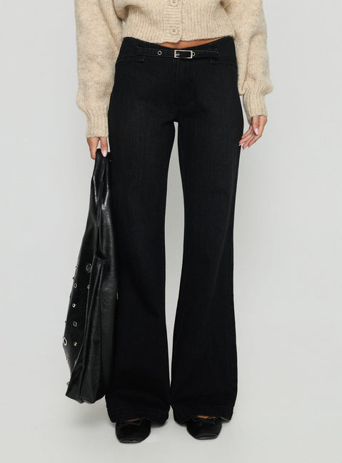 side view of model wearing Princess Polly Slow Ride Mid Rise Bootleg Belted Jeans Washed Black Mid Rise Jeans 