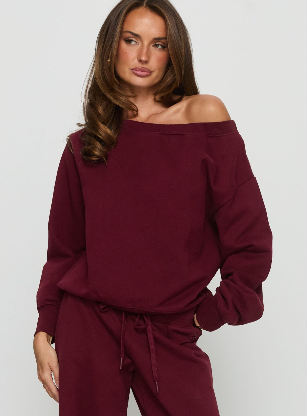 front view of model wearing Princess Polly Wellness Off the Shoulder Jumper Currant cropped Jumpers 