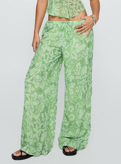 side view of model wearing Princess Polly Finesse Pants Green Floral High Waisted Pants 