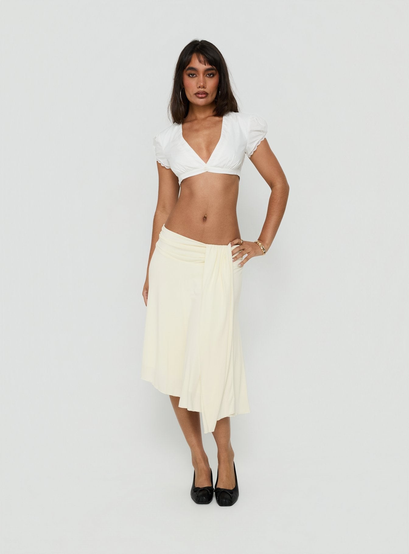 Crafted from cornsilk fabric, the Iselda Draped Midi Skirt Cream in womens-skirts features asymmetry Princess Polly