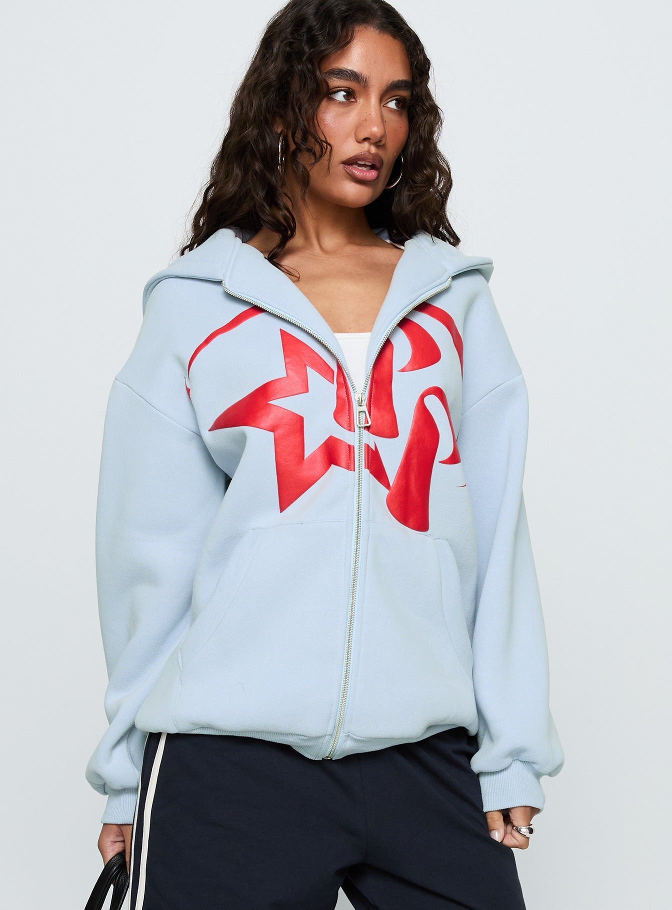 side view of model wearing Princess Polly Starblazer Zip Up Graphic Hoodie Blue / Red Long 
