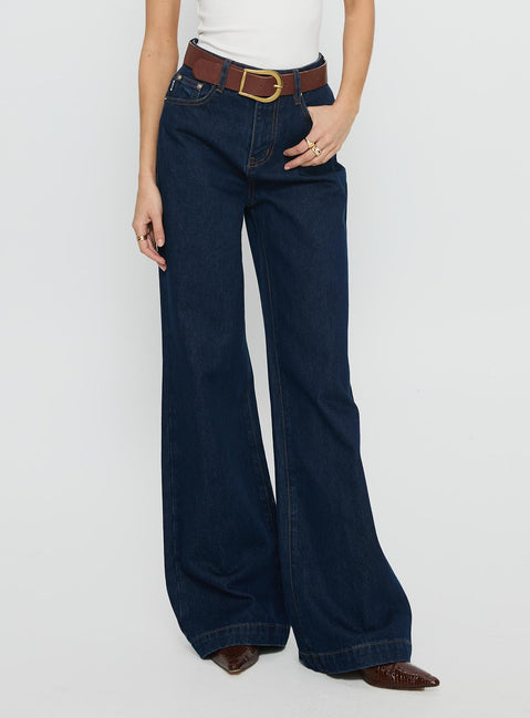 side view of model wearing Princess Polly Goldie High Rise Wide Leg Jeans Indigo High Rise Jeans 