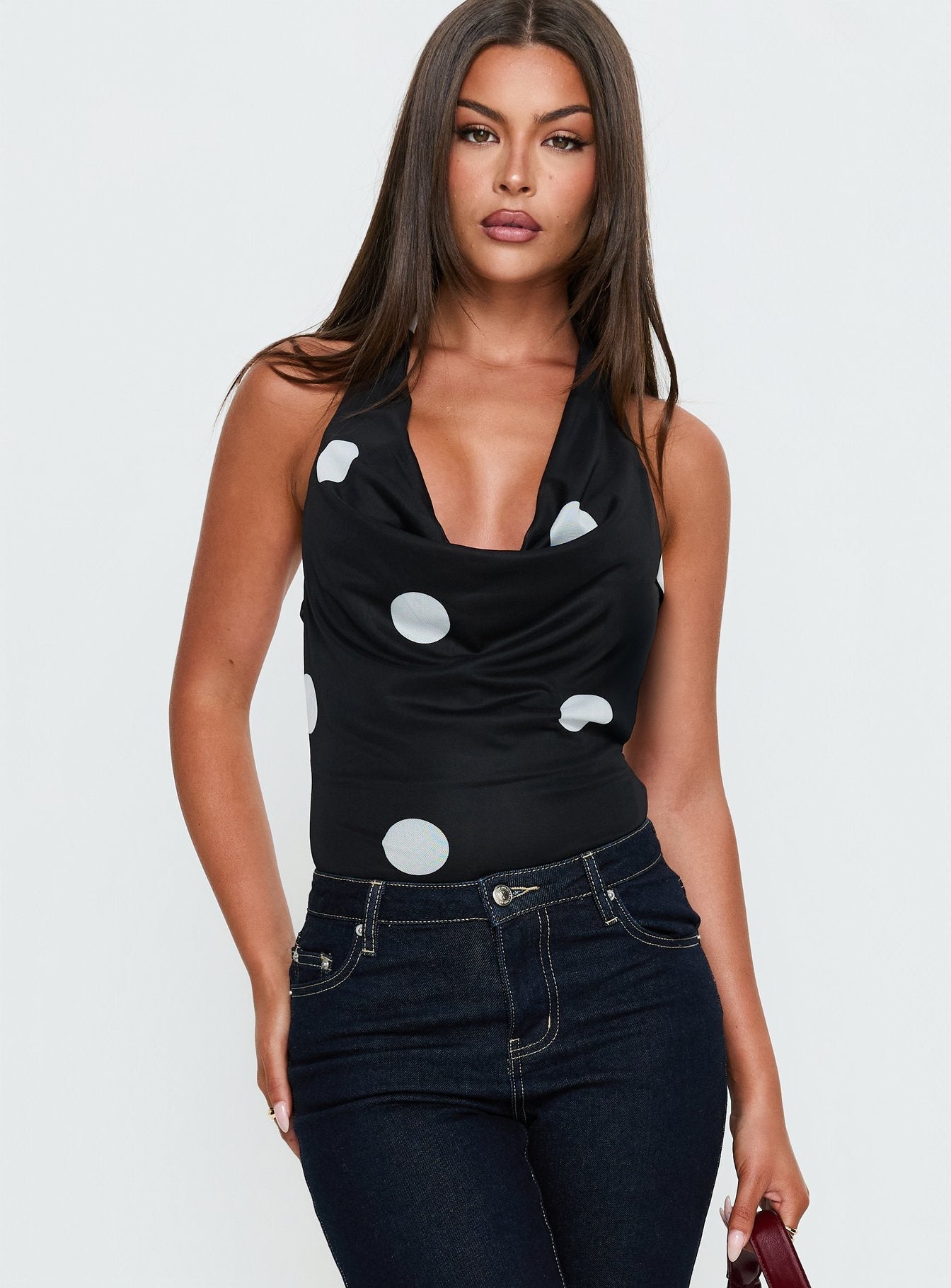 front view of model wearing Princess Polly Cleona Plunge Neck Bodysuit Black Polka Sleeveless 