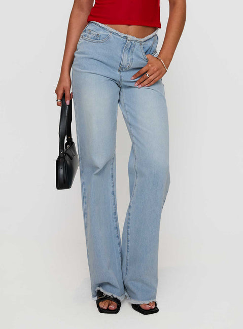 front view of model wearing Princess Polly Hawke Frayed Jeans Mid Blue High Waisted 