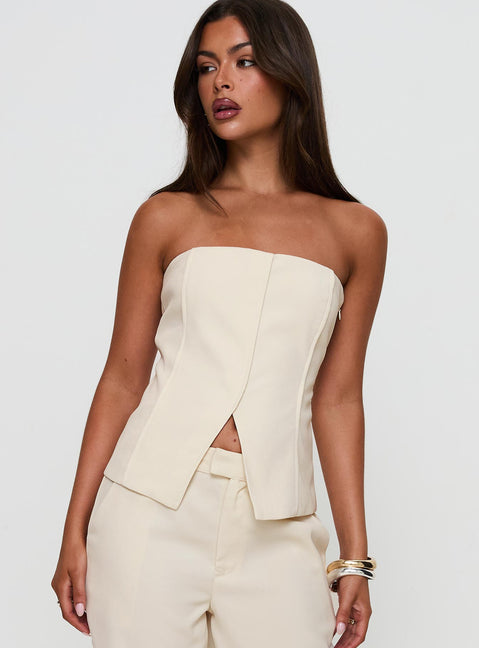 front view of model wearing Princess Polly Lavish Living Strapless Top Cream Sleeveless straight 