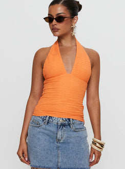 front view of model wearing Princess Polly Emaline Halter Top Orange Sleeveless Plunger 