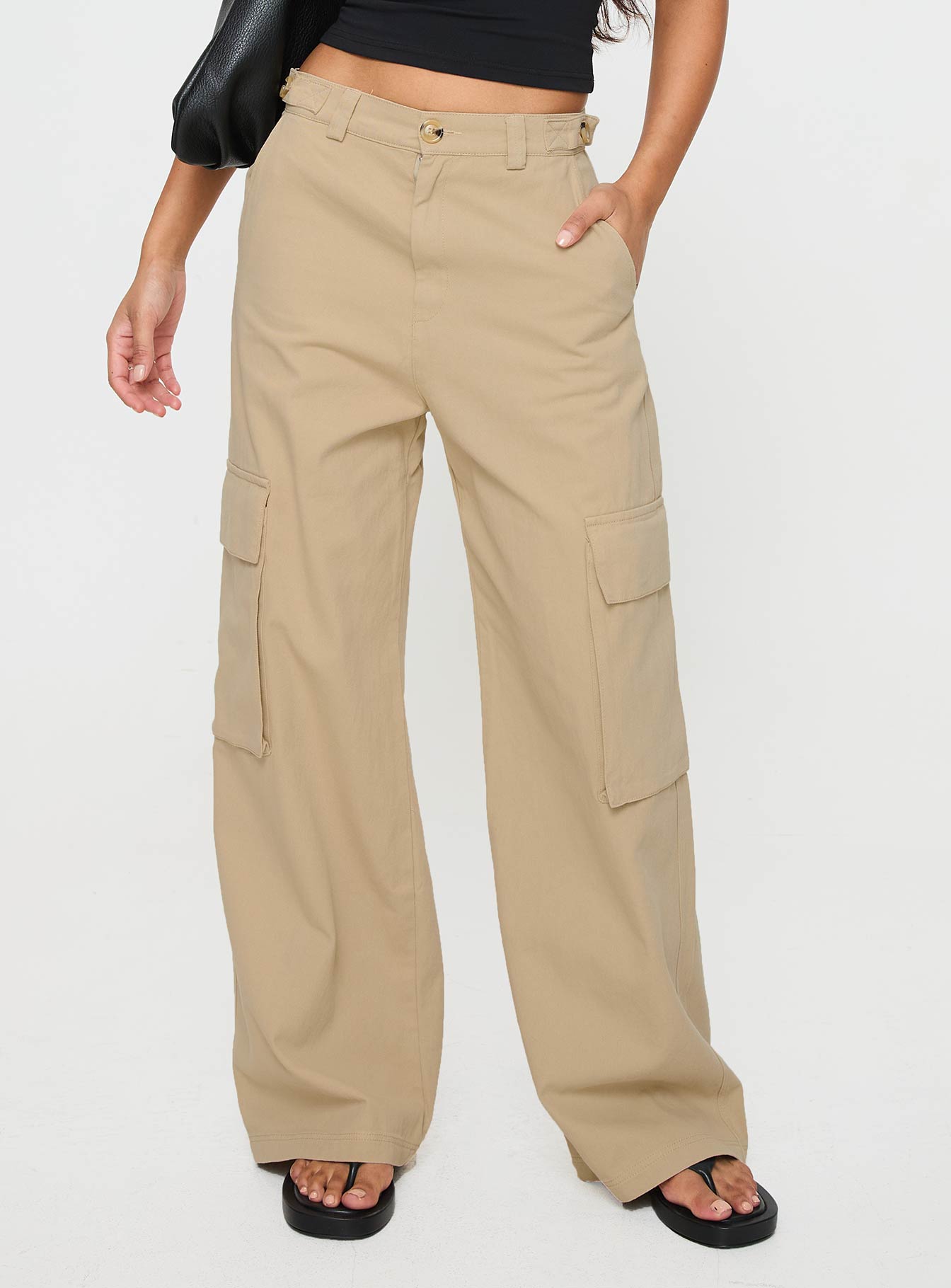 Beige cargo pants Mid rise fit, wide leg, zip pocket design