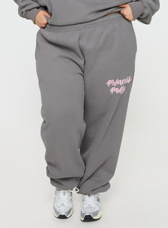 side view of model wearing Princess Polly Princess Polly Track Pants Puff Text Charcoal Curve 