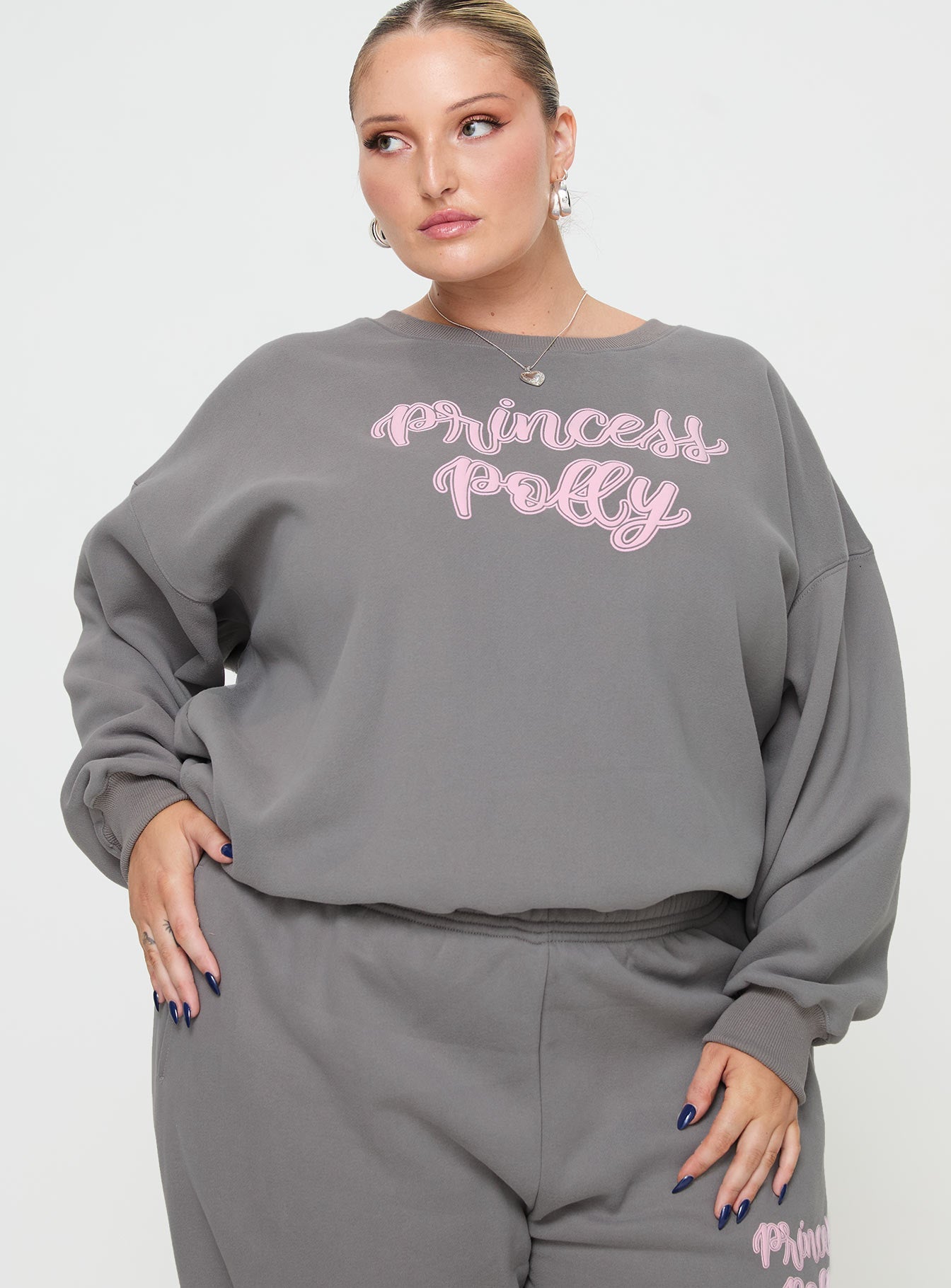 front view of model wearing Princess Polly Princess Polly Crew Neck Sweatshirt Puff Text Charcoal Curve 