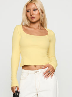front view of model wearing Princess Polly Baseline Long Sleeve Top Yellow Full Sleeves Scoop Neck 