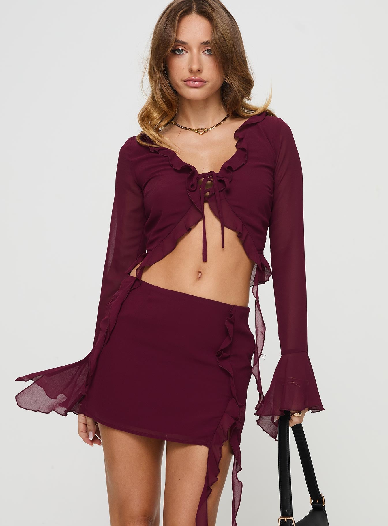 Matching two-piece set Long sleeve style, v-neckline, frill detail, tie fastening, split hem Mini skirt, frill detail, invisible zip fastening Non-stretch material, fully lined  Princess Polly Lower Impact 