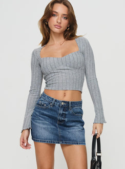   front view of model wearing Princess Polly Arrte Mid Rise Denim Mini Skirt Mid Wash Mini Skirts 
