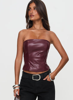 front view of model wearing Princess Polly Oaklee Strapless Faux Leather Top Burgundy Sleeveless straight 