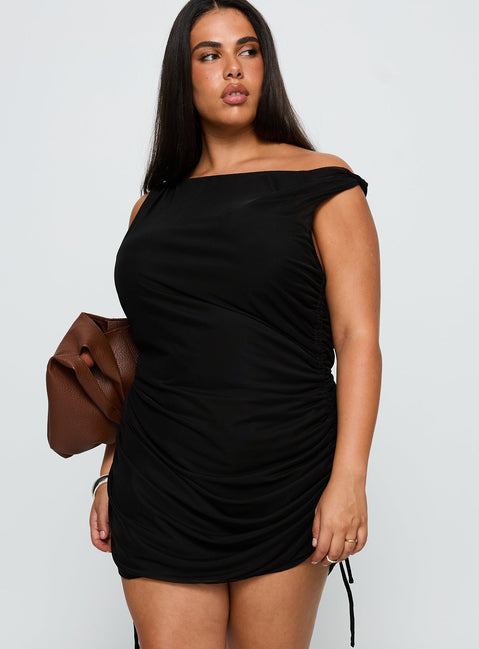 side view of model wearing Princess Polly Bella Luna Ruched Mini Dress Black Curve Asymmetric Neckline 