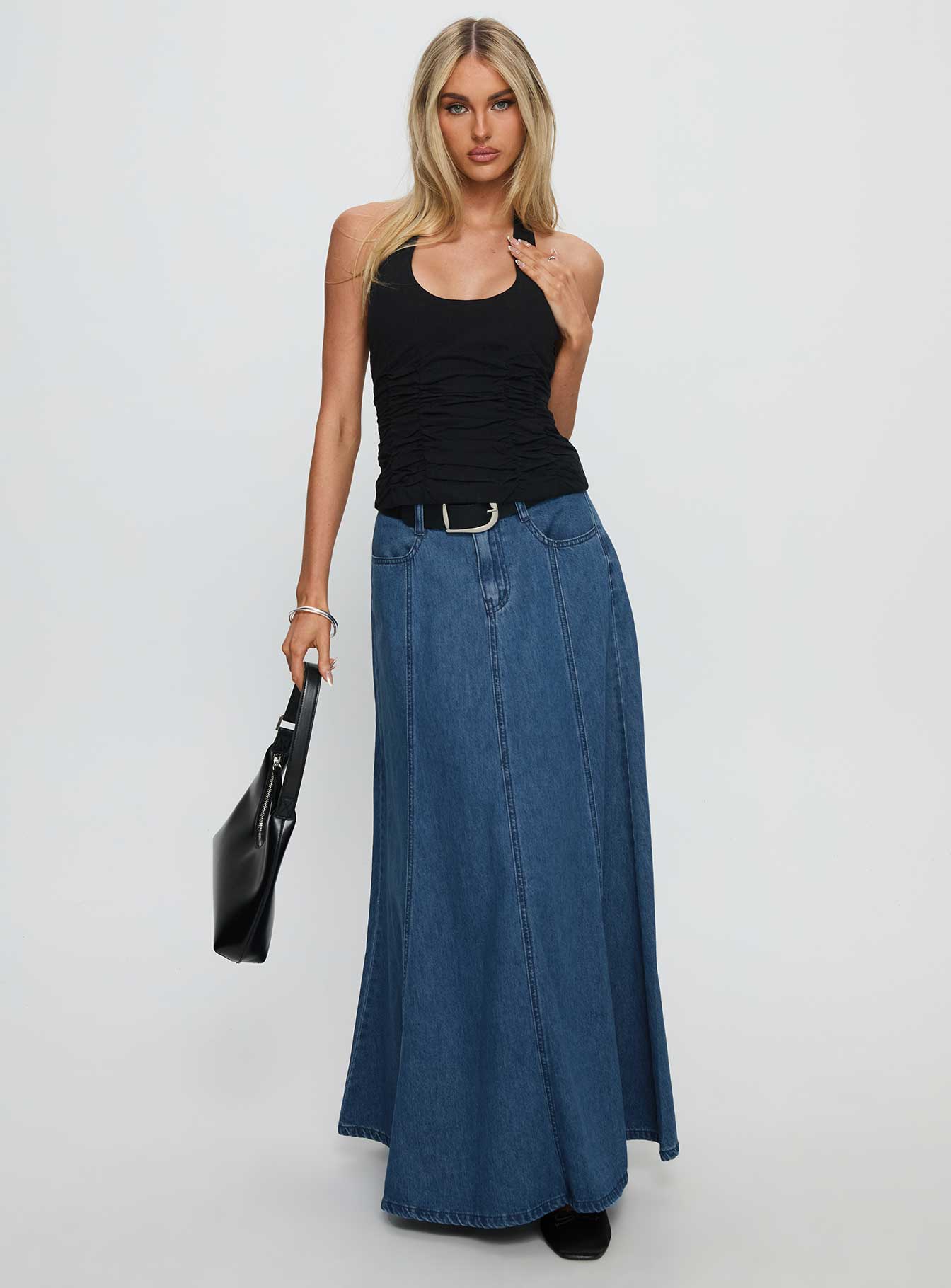   side view of model wearing Princess Polly Charleigh Soft Pleat Denim Maxi Skirt Mid Blue Wash Maxi 