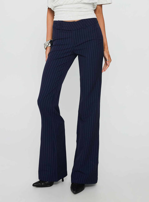back view of model wearing Princess Polly Kinkirk Flared Pants Navy Pinstripe Low Rise Pants 