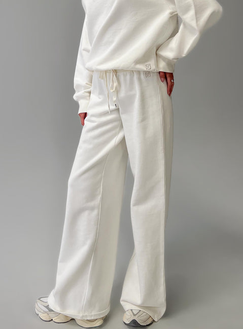 back view of model wearing Princess Polly Dodie Wide Leg Pants Washed White High Rise Pants 