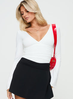 back view of model wearing Princess Polly Xander Long Sleeve Bodysuit White Long Sleeve Tops 