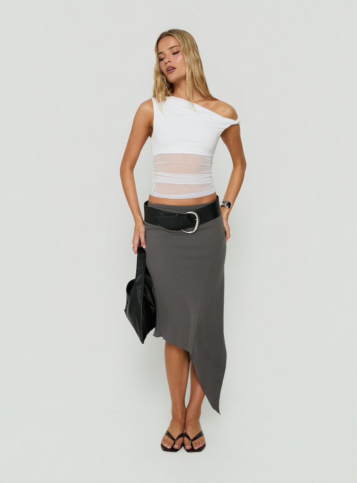Presenting the Aviza Asymmetrical Midi Skirt Grey in womens-skirts with fitted design front view of model wearing Princess Polly