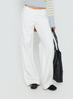 back view of model wearing Princess Polly Hereos Mid Rise Baggy Leg Jeans White Mid Rise Jeans 
