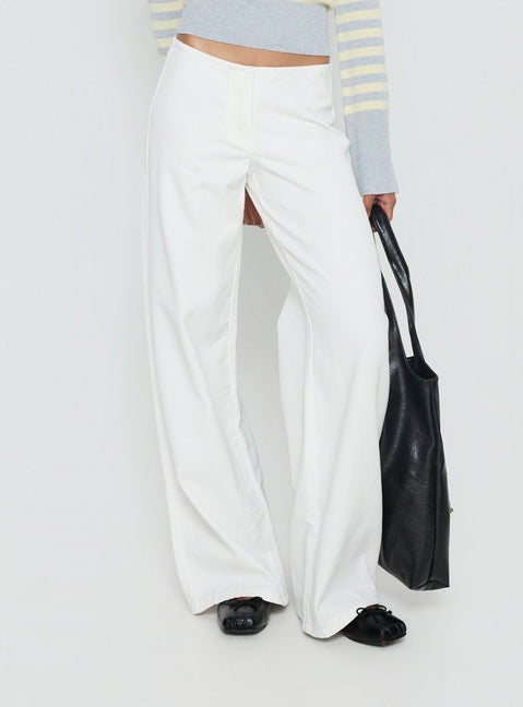 back view of model wearing Princess Polly Hereos Mid Rise Baggy Leg Jeans White Mid Rise Jeans 